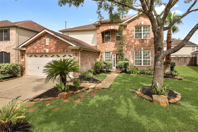 traditional-style home featuring a front lawn, driveway, brick siding, an attached garage, and fence