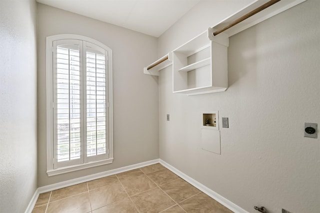 3430 Williams Glen Dr, Sugar Land, TX 77479 - laundry room featuring hookup for an electric dryer, hookup for a washing machine, plenty of natural light, and light tile patterned flooring