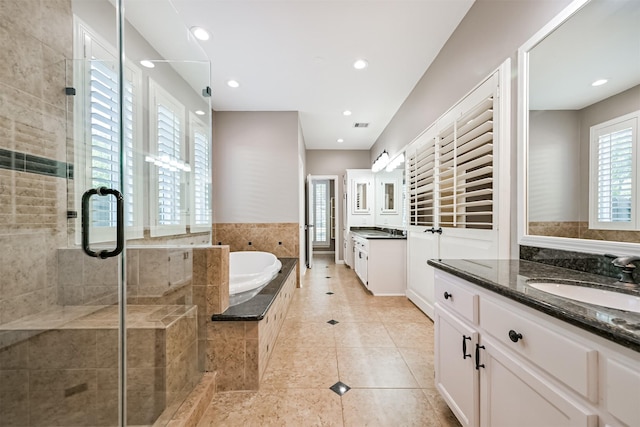 3430 Williams Glen Dr, Sugar Land, TX 77479 - bathroom with a shower stall, tile patterned floors, a garden tub, two vanities, and recessed lighting