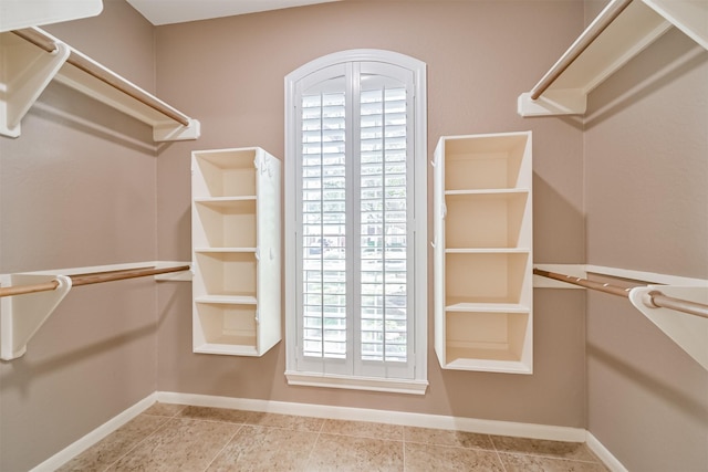 3430 Williams Glen Dr, Sugar Land, TX 77479 - walk in closet featuring tile patterned flooring