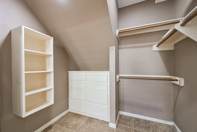 3430 Williams Glen Dr, Sugar Land, TX 77479 - spacious closet featuring lofted ceiling and tile patterned flooring