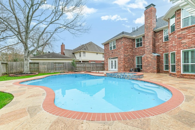 3430 Williams Glen Dr, Sugar Land, TX 77479 - view of swimming pool featuring a fenced backyard, a patio, french doors, and a pool with connected hot tub