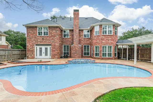 3430 Williams Glen Dr, Sugar Land, TX 77479 - view of pool featuring french doors, a patio, a fenced backyard, a pergola, and a pool with connected hot tub