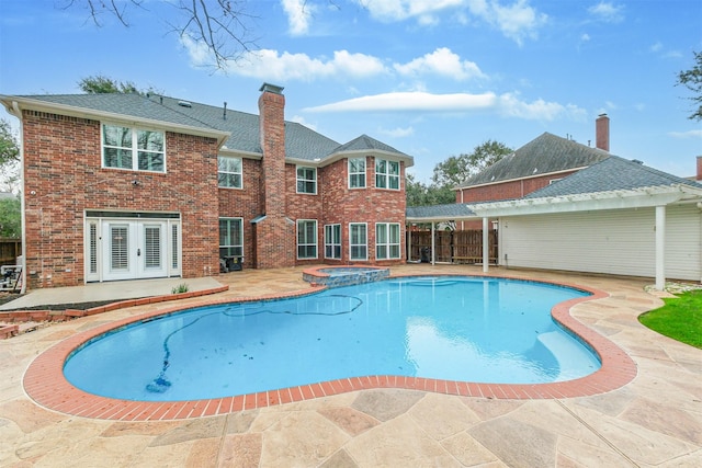 3430 Williams Glen Dr, Sugar Land, TX 77479 - view of swimming pool with french doors, a patio area, and a pool with connected hot tub