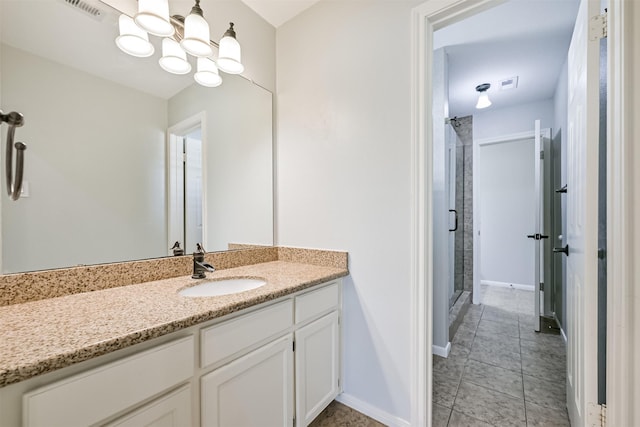3430 Williams Glen Dr, Sugar Land, TX 77479 - bathroom with a stall shower, a chandelier, vanity, baseboards, and tile patterned floors