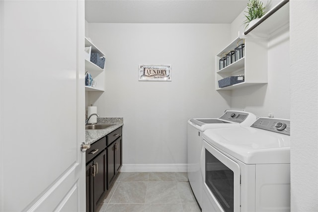 3419 Marlene Meadow Way, Richmond, TX 77406 - laundry area with washer and dryer, cabinet space, baseboards, and light tile patterned floors