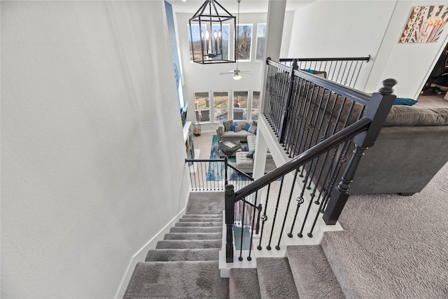 3419 Marlene Meadow Way, Richmond, TX 77406 - stairs with carpet floors, ceiling fan, baseboards, and a towering ceiling