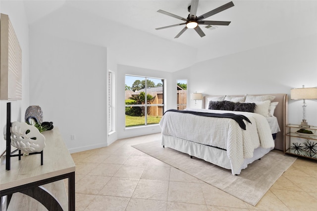 bedroom featuring light tile patterned flooring, a ceiling fan, and vaulted ceiling