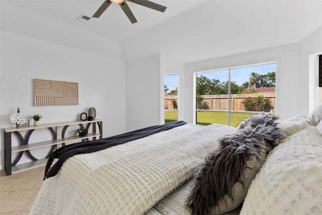 bedroom featuring visible vents, a ceiling fan, tile patterned flooring, and vaulted ceiling