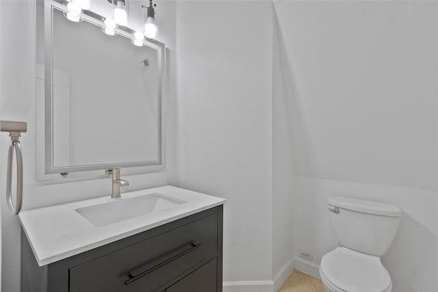 bathroom with tile patterned floors, toilet, and vanity