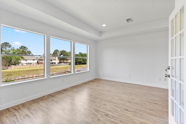 spare room with visible vents, recessed lighting, light wood-style flooring, and baseboards