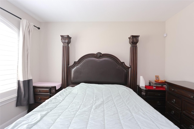 bedroom featuring multiple windows