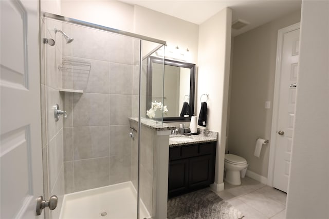 full bath with vanity, toilet, tile patterned floors, visible vents, and a stall shower