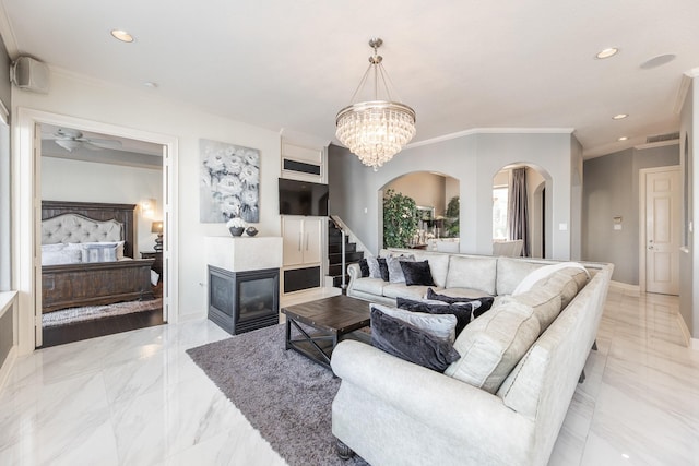 living room featuring arched walkways, a multi sided fireplace, marble finish floor, and baseboards