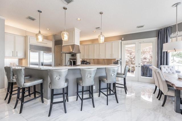 kitchen featuring french doors, visible vents, appliances with stainless steel finishes, and light countertops