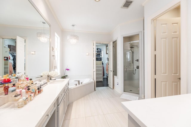 full bathroom featuring a shower stall, vanity, a garden tub, visible vents, and ornamental molding