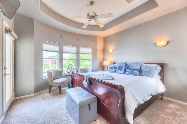 bedroom featuring baseboards, light carpet, and ceiling fan