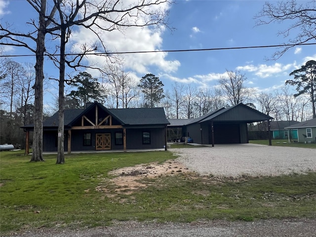 218 Strawberry St, Onalaska, TX 77360 - view of front of house with driveway, an attached carport, covered porch, a front yard, and an attached garage