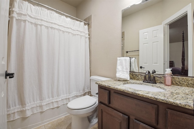 bathroom with shower / bath combo with shower curtain, vanity, toilet, and tile patterned flooring