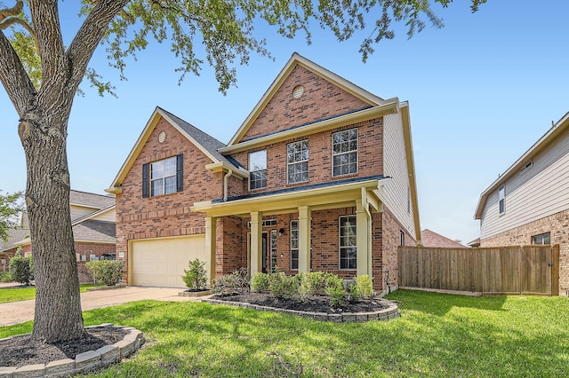 traditional-style home featuring a garage, a front lawn, fence, brick siding, and driveway