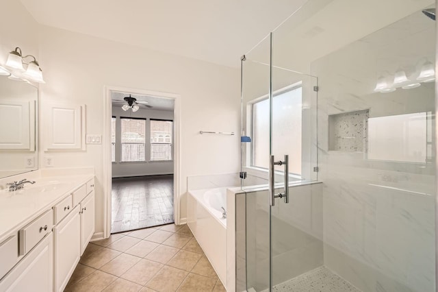 27122 Sable Oaks Ln, Cypress, TX 77433 - full bathroom with a garden tub, tile patterned flooring, vanity, a ceiling fan, and a stall shower
