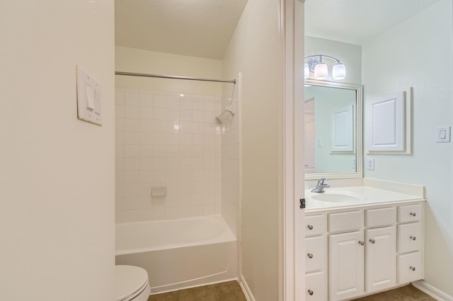 bathroom with vanity, baseboards, toilet, and tub / shower combination