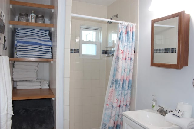 4006 Reeves Dr, Galveston, TX 77554 - bathroom featuring a shower with curtain and vanity