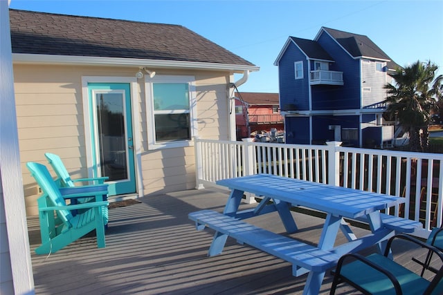 4006 Reeves Dr, Galveston, TX 77554 - wooden deck featuring outdoor dining space