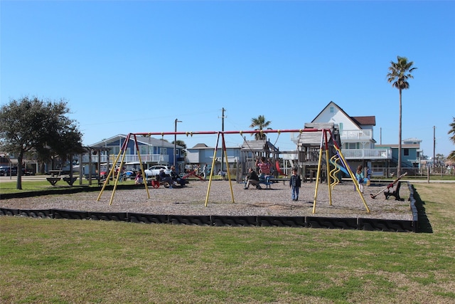 4006 Reeves Dr, Galveston, TX 77554 - community jungle gym featuring a yard