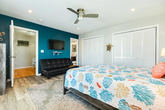 4006 Reeves Dr, Galveston, TX 77554 - bedroom with wood finished floors, two closets, baseboards, recessed lighting, and ensuite bathroom