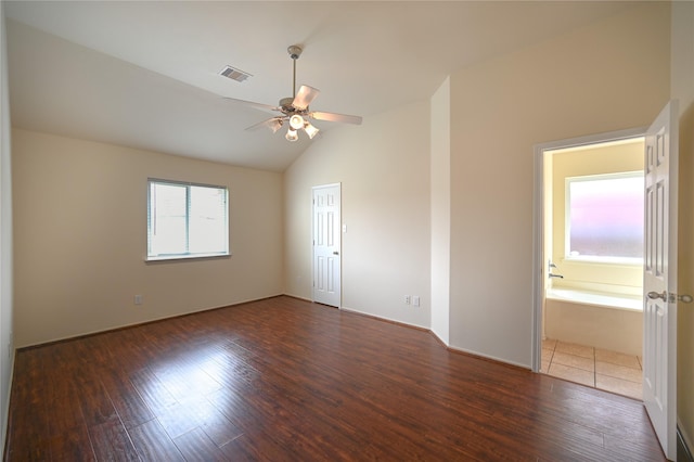 unfurnished room featuring visible vents, wood finished floors, ceiling fan, and lofted ceiling