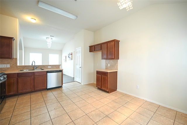 kitchen featuring decorative backsplash, light tile patterned floors, vaulted ceiling, dishwasher, and a sink