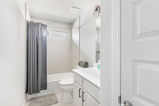 bathroom with visible vents, toilet, shower / bath combination with curtain, vanity, and tile patterned flooring