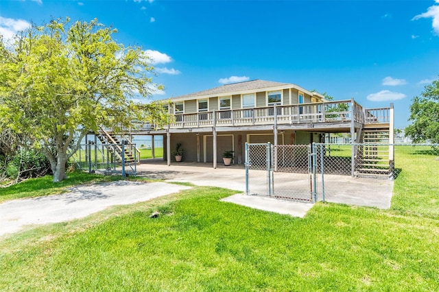 1102 15th St, San Leon, TX 77539 - rear view of house featuring a gate, stairway, fence, a wooden deck, and concrete driveway