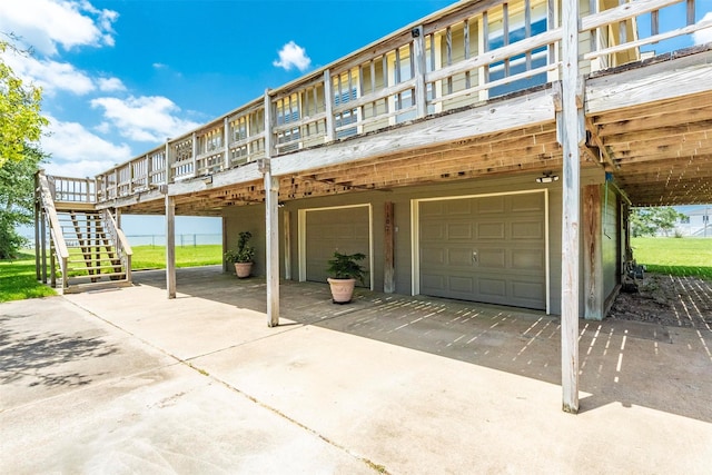 1102 15th St, San Leon, TX 77539 - exterior space with a deck, stairway, and an attached garage