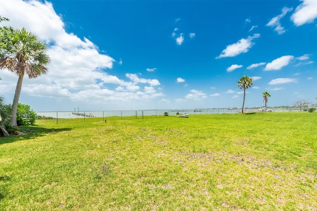 1102 15th St, San Leon, TX 77539 - view of yard featuring a water view and fence