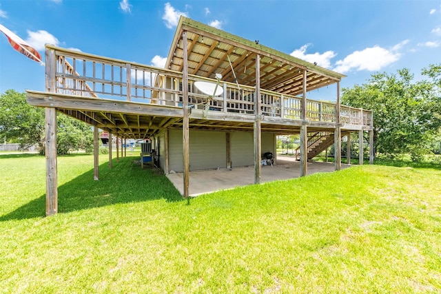 1102 15th St, San Leon, TX 77539 - back of house with a lawn, stairway, a patio area, and a wooden deck
