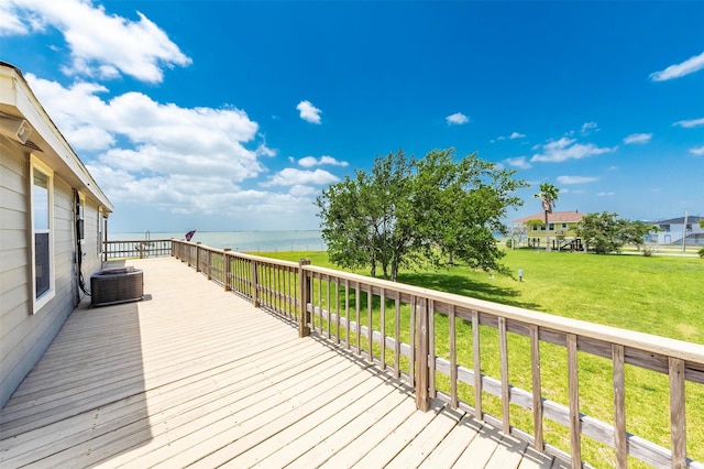 1102 15th St, San Leon, TX 77539 - wooden deck with central AC, a yard, and a water view