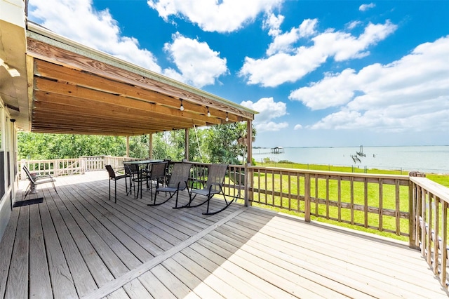 1102 15th St, San Leon, TX 77539 - deck with outdoor dining space and a water view