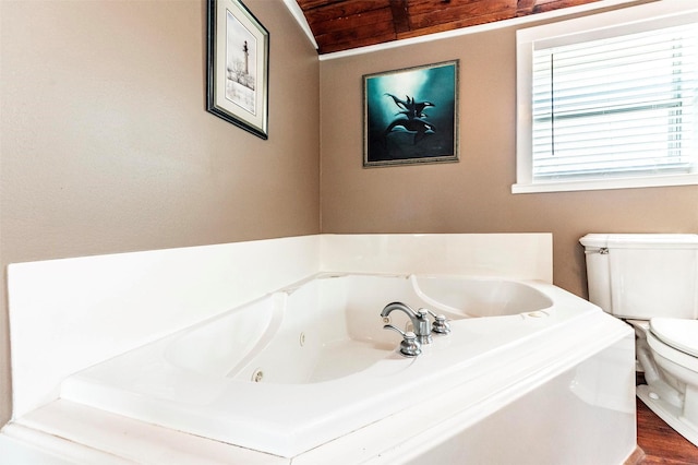 1102 15th St, San Leon, TX 77539 - full bath featuring a tub with jets, wood finished floors, toilet, and wooden ceiling