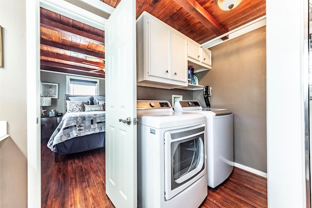 1102 15th St, San Leon, TX 77539 - clothes washing area featuring baseboards, wood ceiling, cabinet space, dark wood-style floors, and washer and clothes dryer