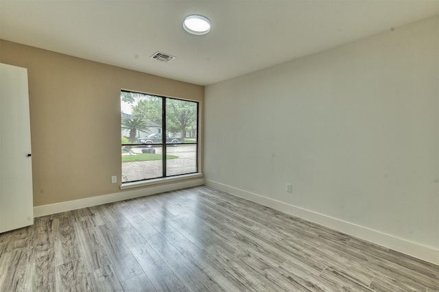 15626 Whitewater Ln, Houston, TX 77079 - spare room with baseboards, visible vents, and wood finished floors