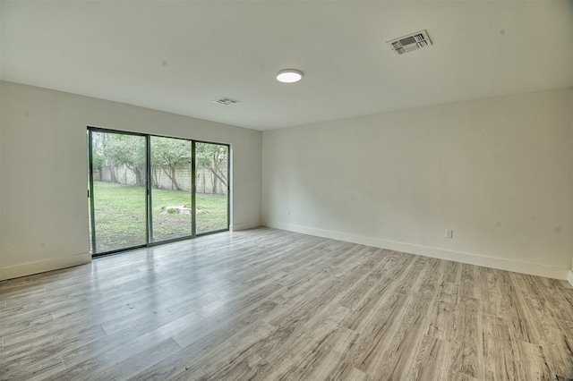 15626 Whitewater Ln, Houston, TX 77079 - unfurnished room featuring visible vents, baseboards, and light wood-type flooring