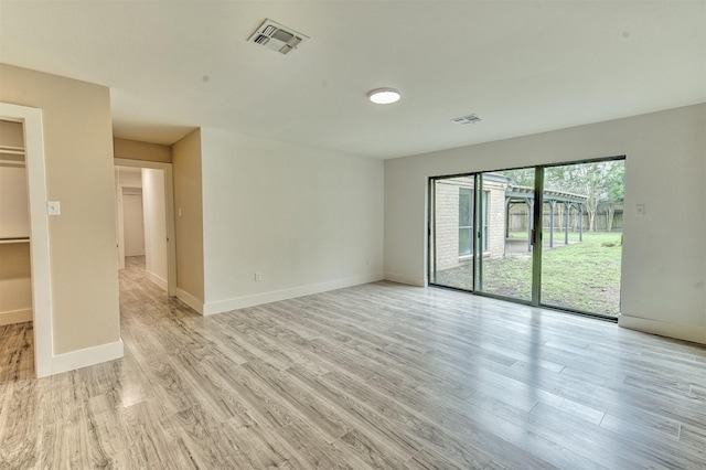 15626 Whitewater Ln, Houston, TX 77079 - unfurnished room with baseboards, visible vents, and light wood-style floors