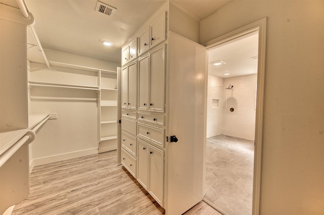 15626 Whitewater Ln, Houston, TX 77079 - spacious closet with visible vents and light wood finished floors