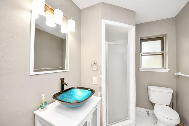 bathroom featuring toilet, vanity, a shower stall, and marble finish floor