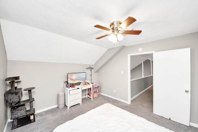 carpeted bedroom with baseboards, ceiling fan, and vaulted ceiling