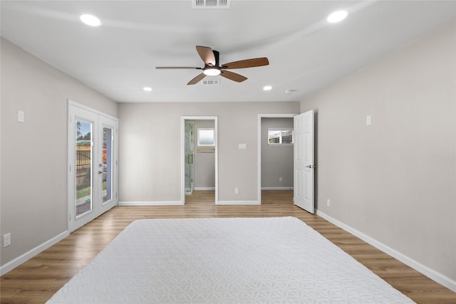 bedroom featuring recessed lighting, light wood finished floors, and access to outside