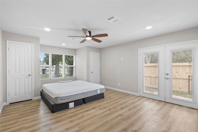 bedroom with visible vents, baseboards, access to outside, and light wood-style floors