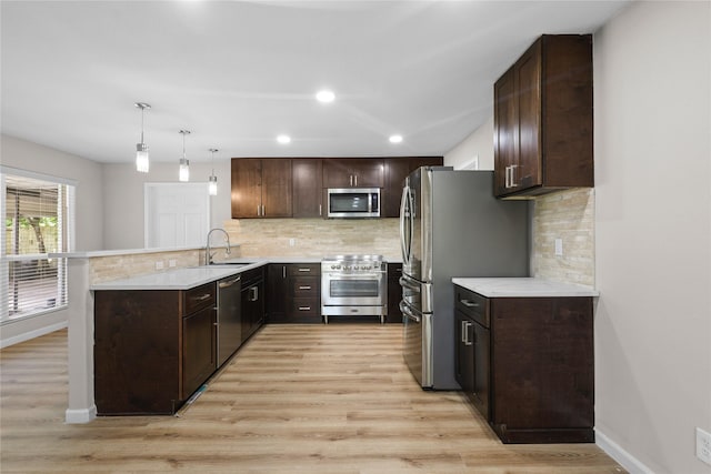 kitchen featuring dark brown cabinetry and stainless steel appliances